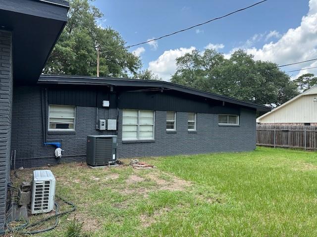 3900 Aggie Dr, Bay City, TX 77414 - back of house featuring brick siding