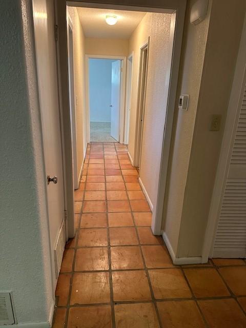 3900 Aggie Dr, Bay City, TX 77414 - corridor with light tile patterned floors