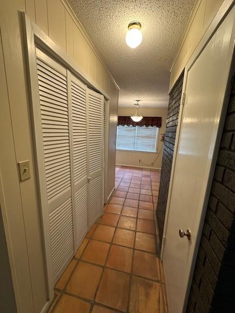 3900 Aggie Dr, Bay City, TX 77414 - hall featuring a textured ceiling