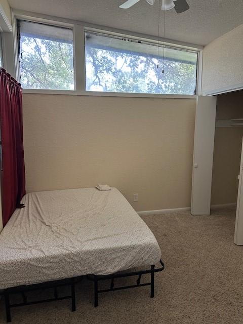 3900 Aggie Dr, Bay City, TX 77414 - bedroom featuring carpet floors and ceiling fan