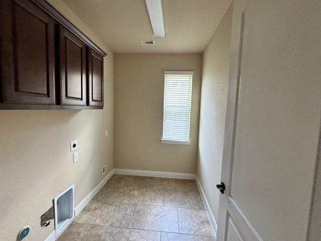 12911 Long Hunter Ct, Humble, TX 77346 - laundry room featuring hookup for an electric dryer and cabinet space