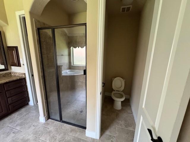 12911 Long Hunter Ct, Humble, TX 77346 - full bathroom featuring vanity, a stall shower, and tile patterned flooring