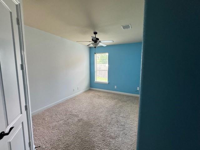 12911 Long Hunter Ct, Humble, TX 77346 - unfurnished room with a ceiling fan and carpet floors