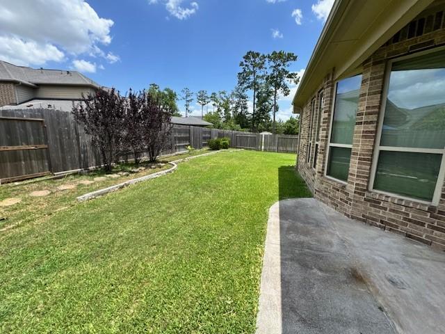 12911 Long Hunter Ct, Humble, TX 77346 - fenced backyard featuring a patio area
