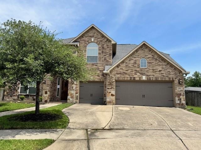 12911 Long Hunter Ct, Humble, TX 77346 - view of front of property with concrete driveway, an attached garage, and brick siding