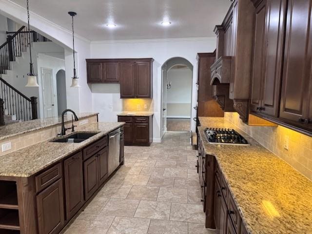 12911 Long Hunter Ct, Humble, TX 77346 - kitchen featuring arched walkways, decorative backsplash, appliances with stainless steel finishes, light stone counters, and crown molding
