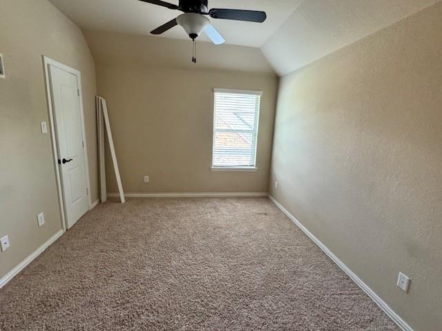 12911 Long Hunter Ct, Humble, TX 77346 - carpeted spare room featuring a ceiling fan and vaulted ceiling