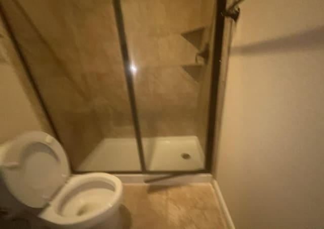 12911 Long Hunter Ct, Humble, TX 77346 - full bathroom with a stall shower and tile patterned flooring