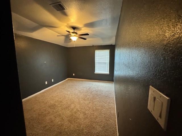 12911 Long Hunter Ct, Humble, TX 77346 - carpeted spare room featuring ceiling fan and baseboards