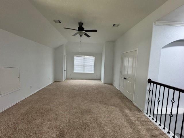 12911 Long Hunter Ct, Humble, TX 77346 - spare room with light carpet, a ceiling fan, lofted ceiling, and arched walkways