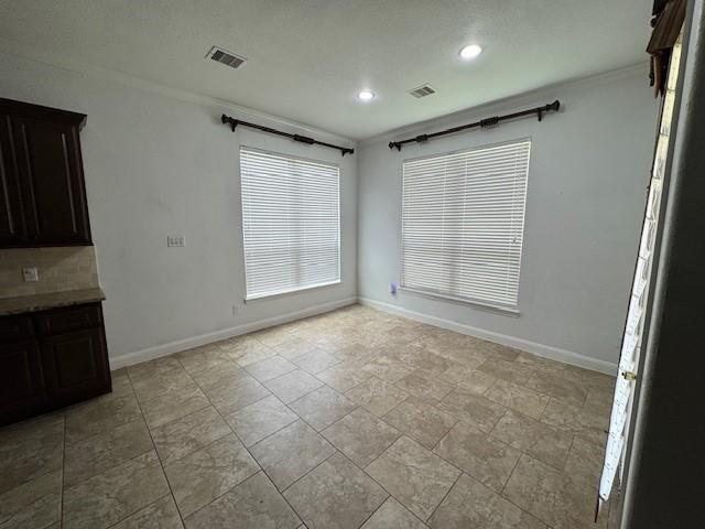 12911 Long Hunter Ct, Humble, TX 77346 - unfurnished dining area featuring recessed lighting and ornamental molding