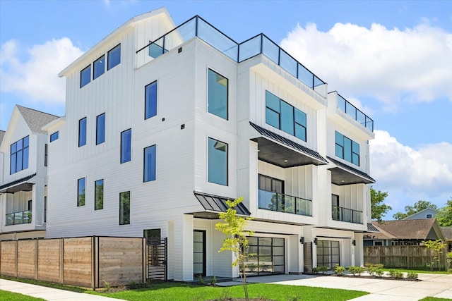 1022 Allston St, Houston, TX 77008 - view of building exterior featuring a garage and driveway