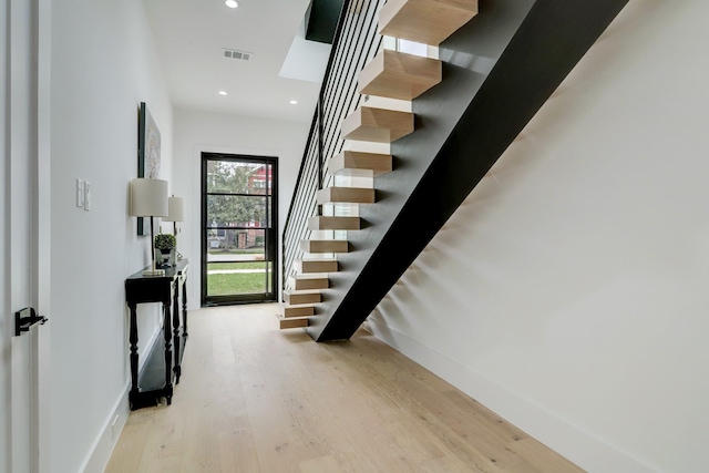 1022 Allston St, Houston, TX 77008 - stairway featuring wood finished floors and recessed lighting