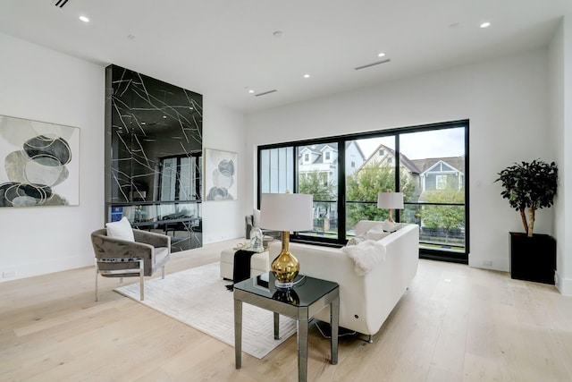 1022 Allston St, Houston, TX 77008 - living area with light wood-type flooring and recessed lighting