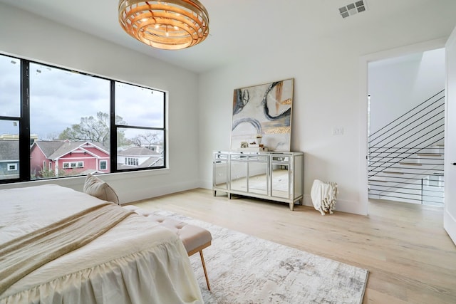 1022 Allston St, Houston, TX 77008 - bedroom featuring wood finished floors and baseboards