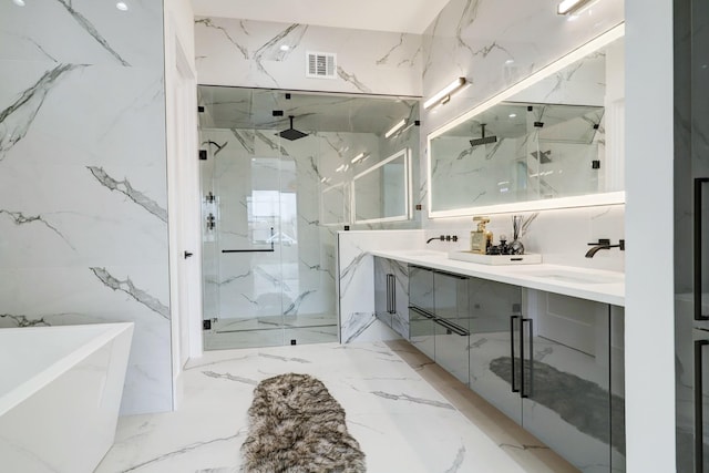 1022 Allston St, Houston, TX 77008 - bathroom with a marble finish shower, double vanity, a freestanding bath, and marble tiled flooring