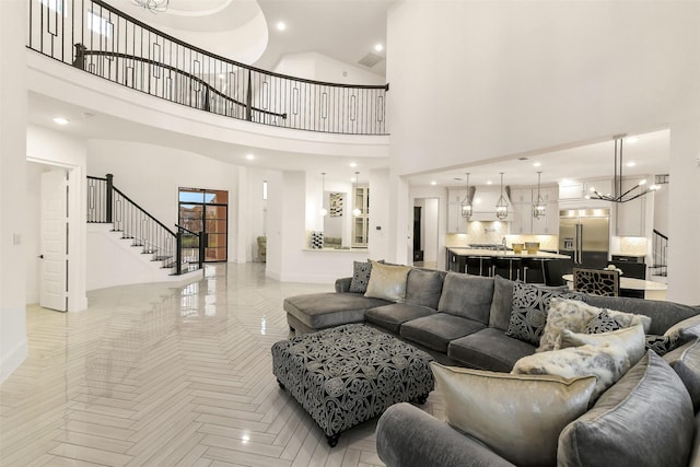 19303 Tree Canopy Ct, Cypress, TX 77433 - living area featuring stairs, a high ceiling, recessed lighting, and a chandelier