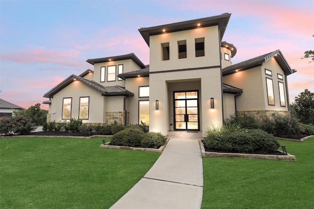 19303 Tree Canopy Ct, Cypress, TX 77433 - modern home with stone siding, stucco siding, and a front yard