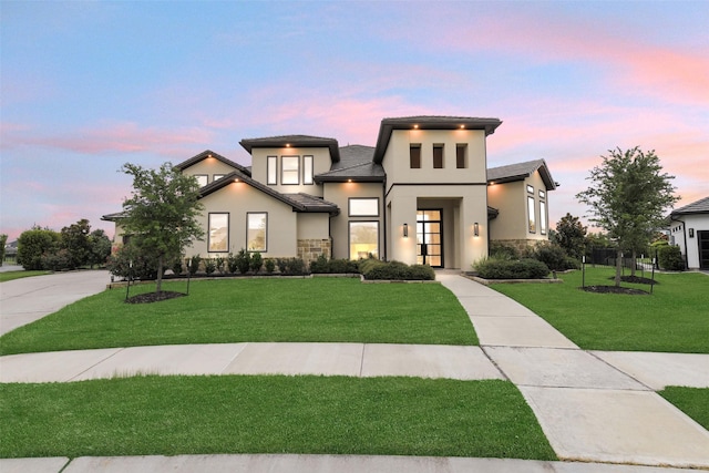19303 Tree Canopy Ct, Cypress, TX 77433 - view of front of home with stucco siding, a front yard, and stone siding