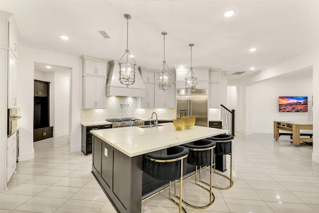 19303 Tree Canopy Ct, Cypress, TX 77433 - kitchen featuring stainless steel appliances, custom range hood, beverage cooler, tasteful backsplash, and light tile patterned flooring