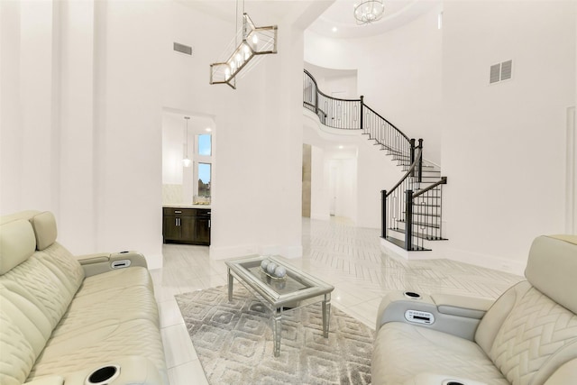 19303 Tree Canopy Ct, Cypress, TX 77433 - living room with a high ceiling, stairway, and light tile patterned floors
