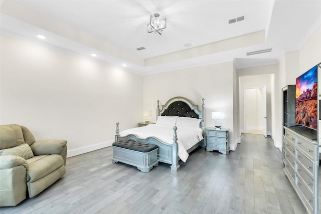 19303 Tree Canopy Ct, Cypress, TX 77433 - bedroom with wood finished floors, recessed lighting, a raised ceiling, and a chandelier
