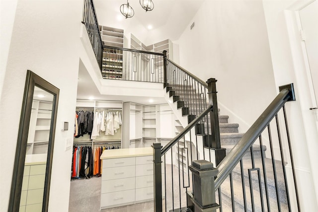 19303 Tree Canopy Ct, Cypress, TX 77433 - stairway with a high ceiling, recessed lighting, and a chandelier