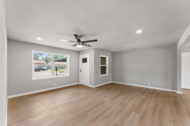 5210 Verdome Ln, Houston, TX 77092 - unfurnished living room with light wood-style flooring, a ceiling fan, and recessed lighting