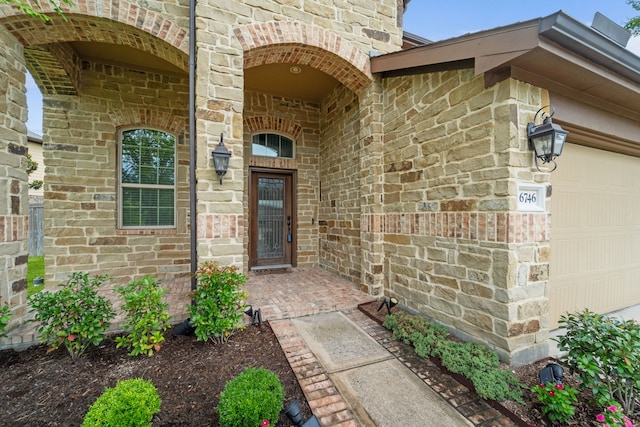16746 Highland Country Dr, Cypress, TX 77433 - view of exterior entry featuring brick siding and a garage