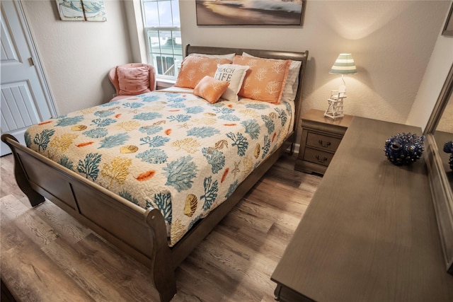 975 S S Cv, Crystal Beach, TX 77650 - bedroom with wood finished floors