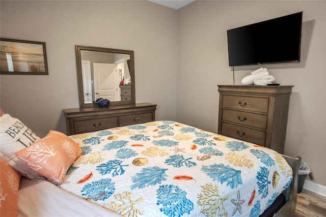 975 S S Cv, Crystal Beach, TX 77650 - bedroom with wood finished floors and baseboards