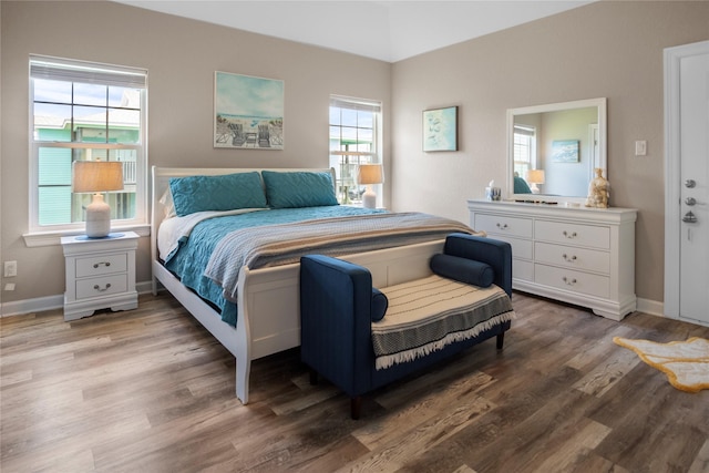 975 S S Cv, Crystal Beach, TX 77650 - bedroom with wood finished floors and baseboards