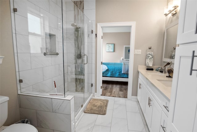 975 S S Cv, Crystal Beach, TX 77650 - ensuite bathroom featuring vanity, a stall shower, and marble finish floors