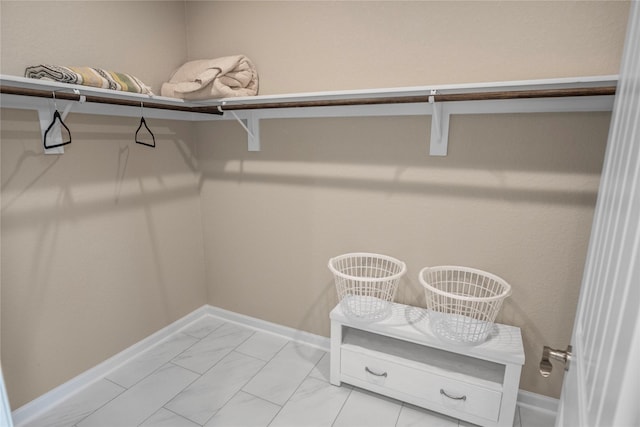 975 S S Cv, Crystal Beach, TX 77650 - spacious closet featuring light marble finish flooring
