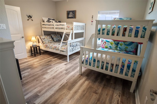 975 S S Cv, Crystal Beach, TX 77650 - bedroom featuring wood finished floors and baseboards