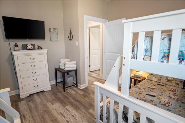 975 S S Cv, Crystal Beach, TX 77650 - bedroom with wood finished floors and baseboards