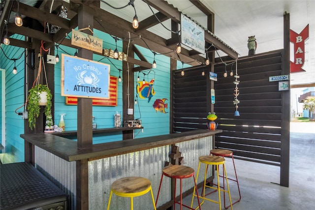 975 S S Cv, Crystal Beach, TX 77650 - indoor dry bar featuring finished concrete floors