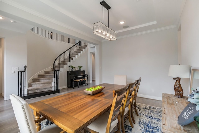19506 Bradford Pines Ct, Cypress, TX 77433 - dining space featuring stairway, wood finished floors, recessed lighting, crown molding, and a chandelier