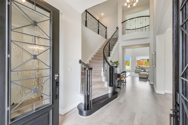 19506 Bradford Pines Ct, Cypress, TX 77433 - entryway with a towering ceiling, stairway, wood finished floors, a chandelier, and recessed lighting