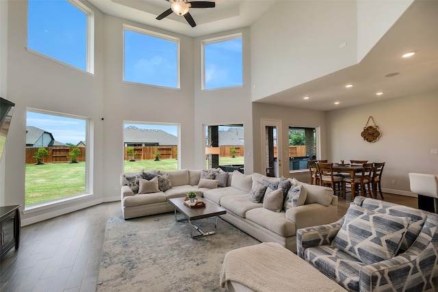 19506 Bradford Pines Ct, Cypress, TX 77433 - living room featuring wood finished floors, a high ceiling, ceiling fan, and recessed lighting
