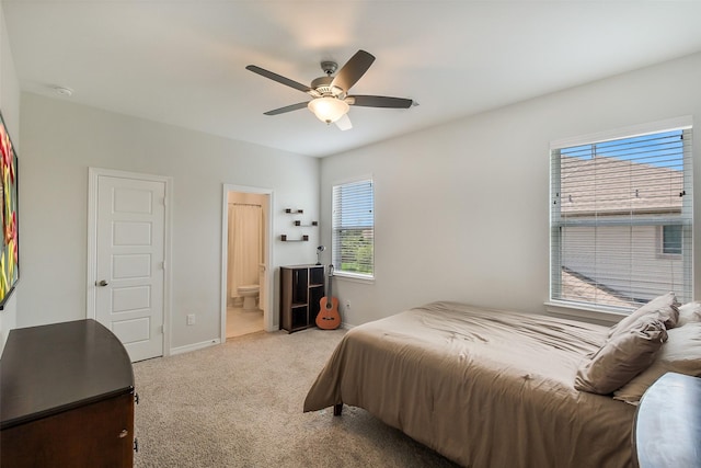 19506 Bradford Pines Ct, Cypress, TX 77433 - carpeted bedroom featuring ensuite bath and ceiling fan