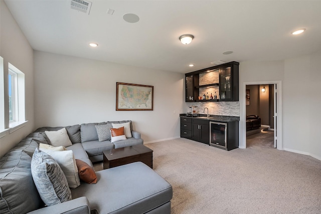 19506 Bradford Pines Ct, Cypress, TX 77433 - living area featuring wet bar, beverage cooler, recessed lighting, and light colored carpet