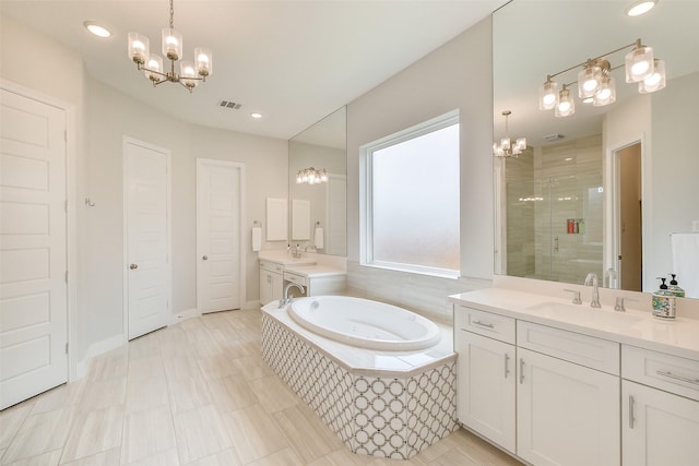 19506 Bradford Pines Ct, Cypress, TX 77433 - full bathroom with a chandelier, two vanities, a shower stall, a bath, and recessed lighting