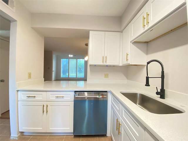 2601 S Braeswood Blvd Unit 605, Houston, TX 77025 - kitchen with dishwasher, white cabinets, light countertops, and light tile patterned floors