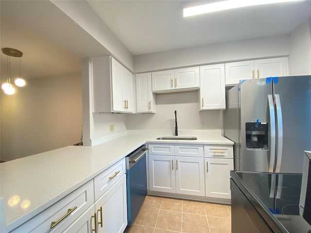 2601 S Braeswood Blvd Unit 605, Houston, TX 77025 - kitchen featuring stainless steel appliances, white cabinetry, light tile patterned floors, light countertops, and pendant lighting