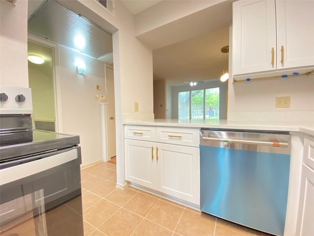 2601 S Braeswood Blvd Unit 605, Houston, TX 77025 - kitchen featuring appliances with stainless steel finishes, white cabinetry, light tile patterned floors, and light countertops