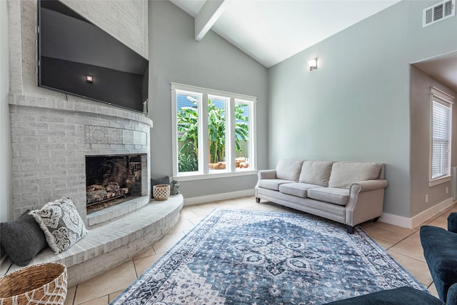 1017 Forest Rd, Clear Lake Shores, TX 77565 - tiled living room with healthy amount of natural light, beam ceiling, high vaulted ceiling, and a brick fireplace