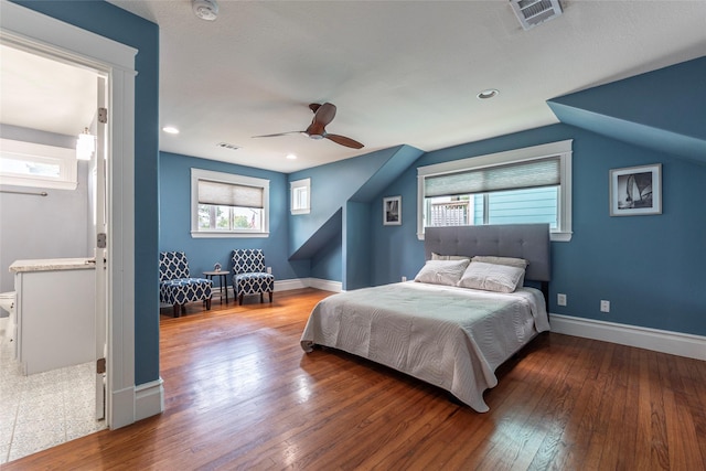 1017 Forest Rd, Clear Lake Shores, TX 77565 - bedroom featuring wood-type flooring, multiple windows, and ceiling fan