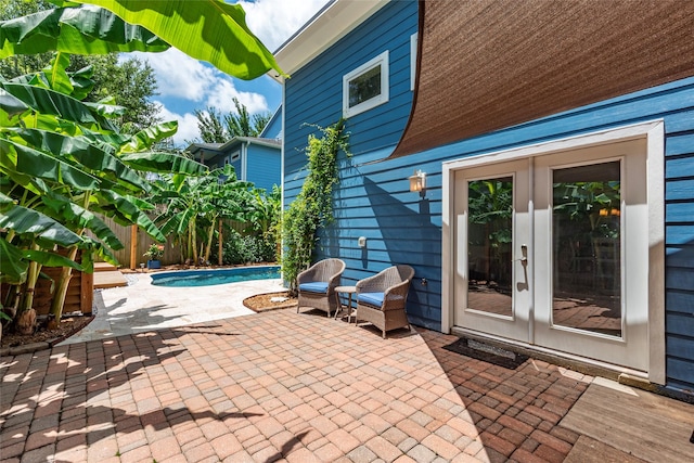 1017 Forest Rd, Clear Lake Shores, TX 77565 - fenced backyard featuring french doors and a patio