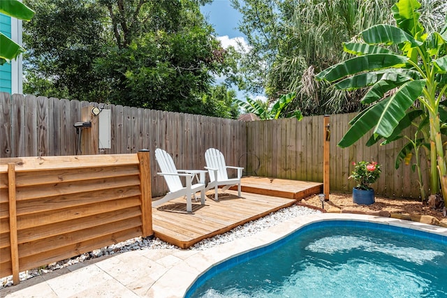 1017 Forest Rd, Clear Lake Shores, TX 77565 - view of pool with a fenced backyard and a wooden deck